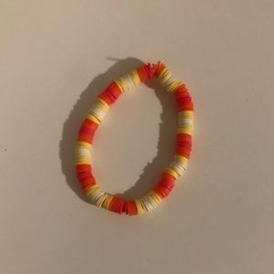 Pink, Orange, Yellow, and white clay bead bracelet